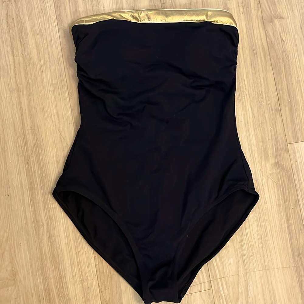 French Brand Livia black and gold one piece. Medium Coverage. 38 US 4 NWOT